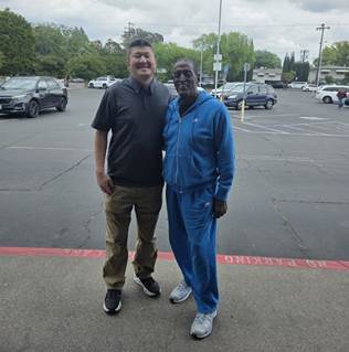 Two people standing in a parking lot

AI-generated content may be incorrect.