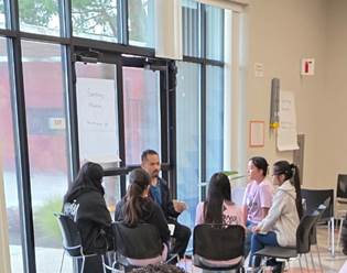 A group of people sitting in a room